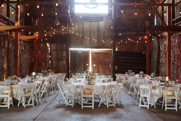 Wedding reception in a converted barn with fairy lights