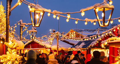 Zurich Christmas Market Snow Laden Lanterns And Strings Of Light Between Market Stalls Above Crowds