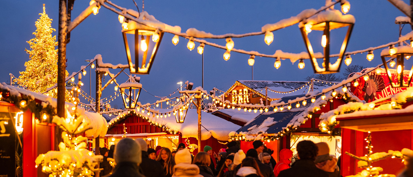 Zurich Christmas Market Snow Laden Lanterns And Strings Of Light Between Market Stalls Above Crowds